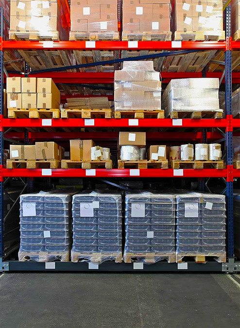 Palletised stock racked and labelled in the warehouse